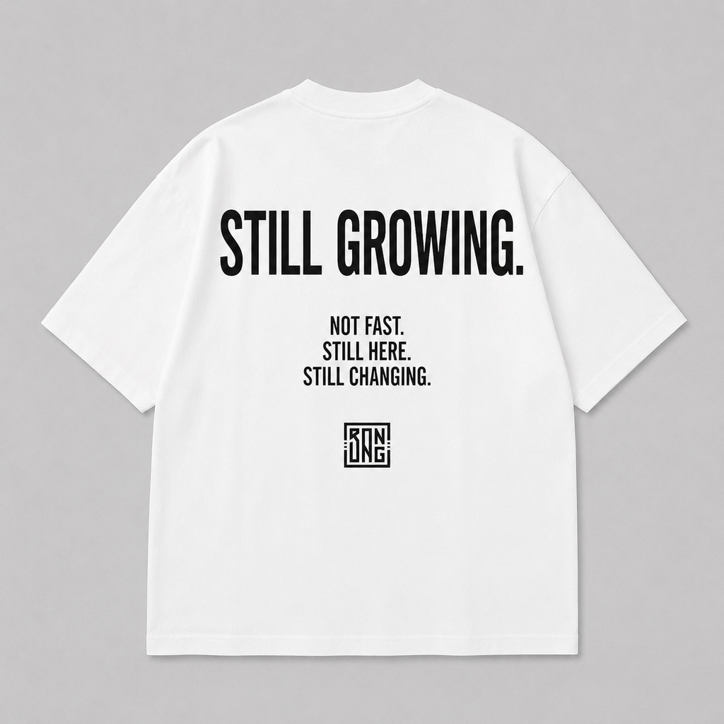 STILL GROWING. TEE