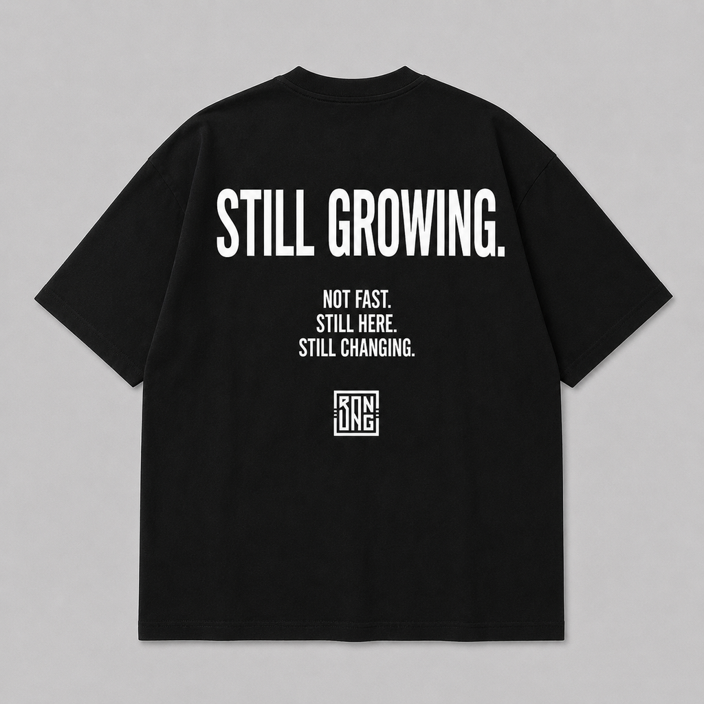STILL GROWING. TEE